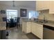 Well-lit kitchen area with granite countertops, stainless steel appliances, and an adjacent dining area with natural light at 11513 Andy Dr, Riverview, FL 33569