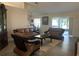 Cozy living room with leather furniture, neutral decor, and tile flooring, creating a comfortable and inviting atmosphere at 11513 Andy Dr, Riverview, FL 33569