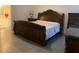 Comfortable main bedroom with ornate bed frame and matching bedroom furniture at 11513 Andy Dr, Riverview, FL 33569
