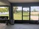 Enclosed patio with a view of the backyard at 11513 Andy Dr, Riverview, FL 33569