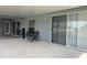 Covered patio with outdoor seating and sliding glass doors at 11513 Andy Dr, Riverview, FL 33569