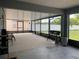Wide screened patio with a grill and seating at 11513 Andy Dr, Riverview, FL 33569