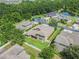 Aerial view of a well-maintained home with a large yard and mature trees at 1342 Salmonberry St, Wesley Chapel, FL 33543