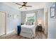 Inviting bedroom with a plush bed, colorful decor, and a ceiling fan for added comfort at 1342 Salmonberry St, Wesley Chapel, FL 33543
