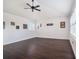 Spacious bonus room with dark floors, white walls, and natural light at 1342 Salmonberry St, Wesley Chapel, FL 33543