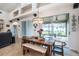 Bright dining area with sliding glass doors leading to an outdoor patio at 1342 Salmonberry St, Wesley Chapel, FL 33543