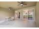 Covered lanai with dual ceiling fans and views into the backyard at 1342 Salmonberry St, Wesley Chapel, FL 33543