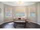 Cozy sitting area with natural light and hardwood floors, perfect for relaxation and reading at 1342 Salmonberry St, Wesley Chapel, FL 33543