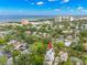 Picturesque aerial view of a charming neighborhood with a home featuring solar panels and coastal views at 1400 Cherry Ne St, St Petersburg, FL 33704