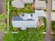 Stunning aerial view of a home with solar panels and lush landscaping in a desirable neighborhood at 1400 Cherry Ne St, St Petersburg, FL 33704