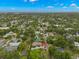 An aerial view showing this home in a tree-lined neighborhood with lush greenery at 1400 Cherry Ne St, St Petersburg, FL 33704