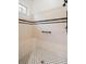 Bright bathroom features tiled walls, black and white mosaic tile floor, and a built-in shower seat at 1400 Cherry Ne St, St Petersburg, FL 33704