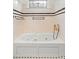 A soaking tub with jets and black and white tiling detail at 1400 Cherry Ne St, St Petersburg, FL 33704