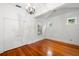 A well-lit bedroom featuring hardwood floors, white trim, and a closet at 1400 Cherry Ne St, St Petersburg, FL 33704