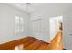Bright bedroom features wood floors, white trim and a bi-fold closet at 1400 Cherry Ne St, St Petersburg, FL 33704