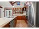 A large kitchen with stainless steel appliances, custom cabinetry, and a center island with a sink at 1400 Cherry Ne St, St Petersburg, FL 33704