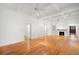 Spacious living room with hardwood floors, fireplace, and coffered ceiling, bathed in natural light at 1400 Cherry Ne St, St Petersburg, FL 33704