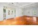 Bright living room featuring hardwood floors, coffered ceilings, and decorative window accents at 1400 Cherry Ne St, St Petersburg, FL 33704
