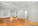 Bright open living room with hardwood floors and coffered ceilings, showcasing classic design at 1400 Cherry Ne St, St Petersburg, FL 33704