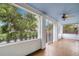Relaxing screened porch with ceiling fan and swing, perfect for enjoying the outdoors at 1400 Cherry Ne St, St Petersburg, FL 33704