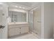Clean bathroom featuring walk-in shower and plenty of counter space at 1401 Camelot Ct, Palm Harbor, FL 34684