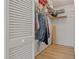 Organized walk-in closet with shelves and hanging storage, offering ample space for clothes and accessories at 1401 Camelot Ct, Palm Harbor, FL 34684