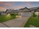 Charming one story home featuring a lush landscaped yard and attached two car garage at 1401 Camelot Ct, Palm Harbor, FL 34684