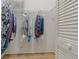 Walk-in closet with ample storage and shelving for all your clothing and accessories at 1401 Camelot Ct, Palm Harbor, FL 34684
