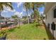Scenic waterfront backyard with lush lawn and a private boat dock with lift at 1424 47Th Ne Ave, St Petersburg, FL 33703