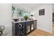 Bar area with built-in wine storage, a wine fridge, and counter space for serving drinks at 1424 47Th Ne Ave, St Petersburg, FL 33703