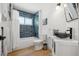 Modern bathroom featuring blue tiled shower, black fixtures, and vessel sink with white vanity at 1424 47Th Ne Ave, St Petersburg, FL 33703