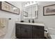 Bathroom featuring a modern vanity with marble countertop and a lighted medicine cabinet at 1424 47Th Ne Ave, St Petersburg, FL 33703