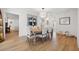 Bright dining room featuring beachy decor, hardwood floors, and a modern chandelier at 1424 47Th Ne Ave, St Petersburg, FL 33703