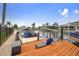 Inviting waterfront view from the wooden dock with outdoor seating, providing direct access to the serene canal at 1424 47Th Ne Ave, St Petersburg, FL 33703