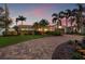 Charming single-story home with a brick driveway, well-kept lawn, and beautiful landscaping at 1424 47Th Ne Ave, St Petersburg, FL 33703
