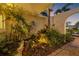 Inviting front walkway featuring beautiful landscaping and a peaceful water feature at 1424 47Th Ne Ave, St Petersburg, FL 33703