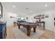 Game room with a beautiful blue pool table and natural light from the window at 1424 47Th Ne Ave, St Petersburg, FL 33703