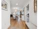 Hallway view into the bright dining room, offering open floorplan and easy access to kitchen at 1424 47Th Ne Ave, St Petersburg, FL 33703