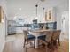 Bright kitchen with modern stainless steel appliances, white cabinetry, and breakfast bar with seating at 1424 47Th Ne Ave, St Petersburg, FL 33703