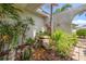 Lush landscaping featuring a rock garden and peaceful water feature adds charm to this home at 1424 47Th Ne Ave, St Petersburg, FL 33703