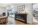 Cozy fireplace with a view to a pool through sliding glass doors, creating a warm and inviting atmosphere at 1424 47Th Ne Ave, St Petersburg, FL 33703