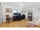 Bright office space with light wood floors, built-in desk and shelving, and natural light from two windows at 1424 47Th Ne Ave, St Petersburg, FL 33703