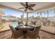 Covered patio with dining table, ceiling fan, and waterfront views in a relaxing setting at 1424 47Th Ne Ave, St Petersburg, FL 33703