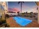 Backyard pool, waterfront views, outdoor grill, and patio seating area perfect for relaxation at 1424 47Th Ne Ave, St Petersburg, FL 33703