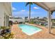 Backyard with a refreshing pool, outdoor seating, grill and a waterfront view at 1424 47Th Ne Ave, St Petersburg, FL 33703