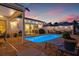 Backyard with a sparkling pool, beautiful brick pavers and outdoor seating for entertaining at 1424 47Th Ne Ave, St Petersburg, FL 33703