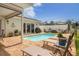 Inviting swimming pool with brick patio and comfortable outdoor seating at 1424 47Th Ne Ave, St Petersburg, FL 33703