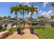 Beautiful waterfront view from a property with mature palm trees at 1424 47Th Ne Ave, St Petersburg, FL 33703