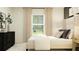 Well-lit bedroom with a cozy bed, neutral palette, and tasteful decorations at 14958 Topaz Blue St, Wimauma, FL 33598