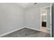 Bright bedroom with carpeted floors, neutral paint, and an en-suite bathroom with dark wood cabinets at 1902 Marshberry Ct, New Port Richey, FL 34655